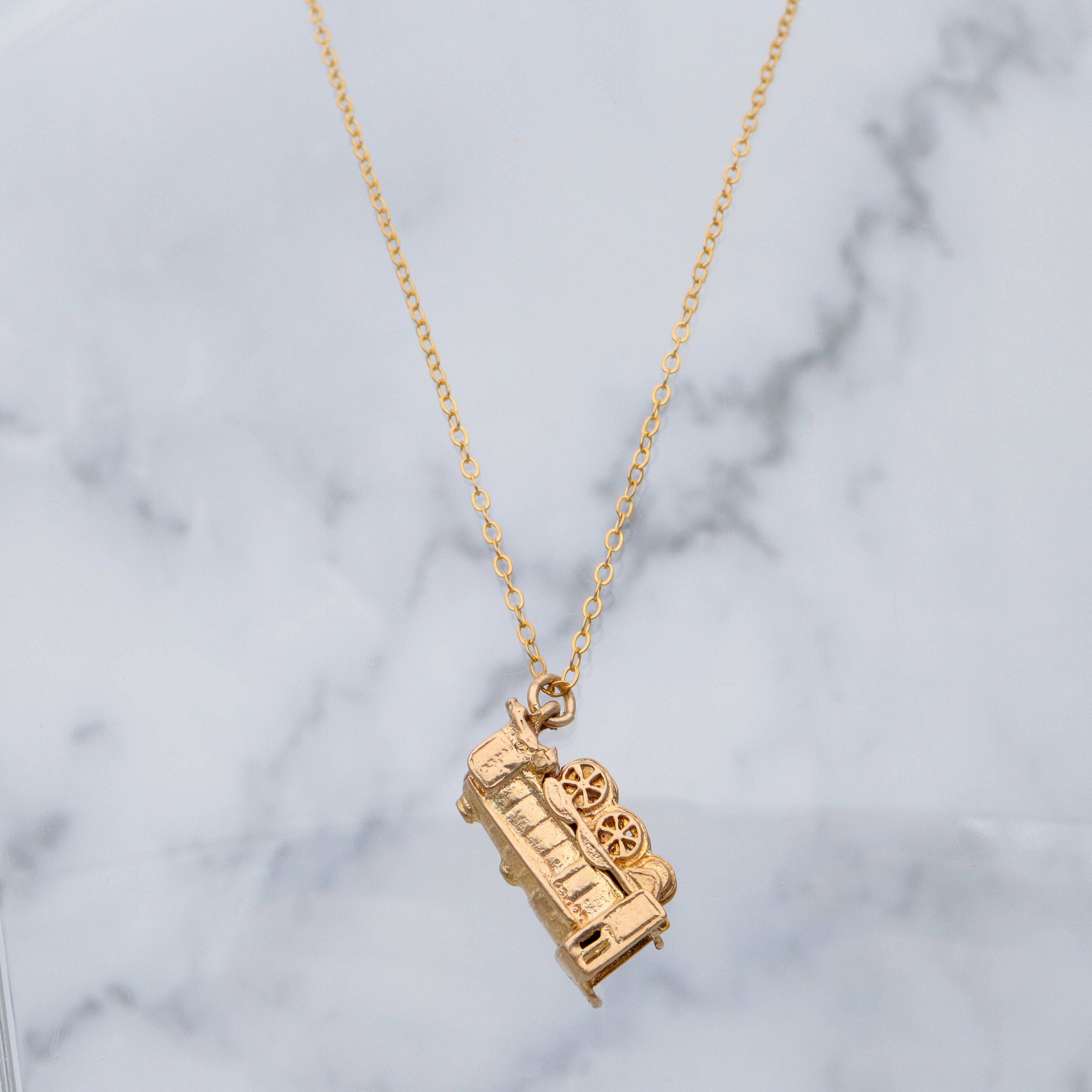 Vintage English 9k gold opening “Bon Voyage” locomotive charm